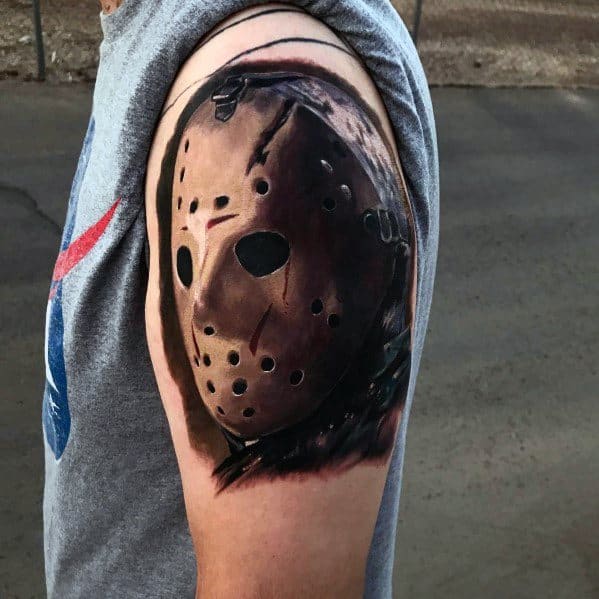 Realistic tattoo of Jason Voorhees' hockey mask from *Friday the 13th*, featuring detailed shading and depth for a chilling horror look.