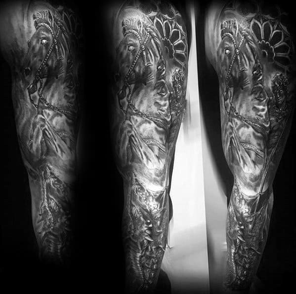 Full sleeve black and grey tattoo of a horse with floral elements, realistic shading, and intricate background details