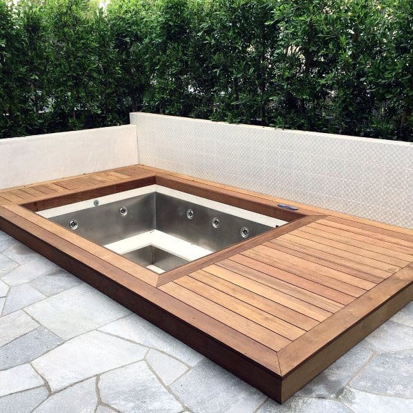 wood deck hot tub on stone patio