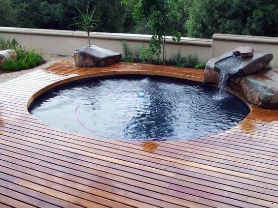 built-in hot tub wood deck water fountain feature