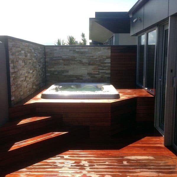 wood deck elevated hot tub stone privacy wall