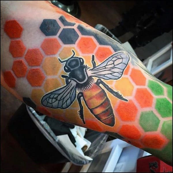 Huge Bee On Top Of Colorful Honeycomb Tattoo