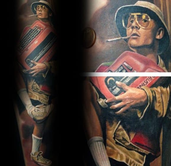 Realistic Hunter S. Thompson tattoo featuring him in aviator glasses, a bucket hat, and a cigarette, carrying a red typewriter in a dynamic pose.
