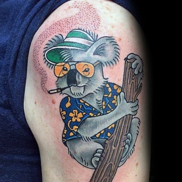 Fun Hunter S. Thompson-inspired tattoo featuring a koala wearing aviator glasses, a bucket hat, a tropical shirt, and a cigarette while climbing a tree.