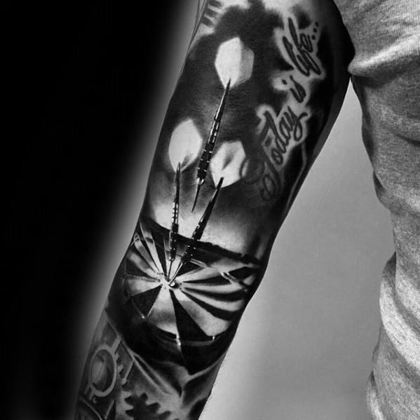 Realistic black and grey tattoo sleeve with three darts in a dartboard and “Today is Life...” script, symbolizing living in the moment.