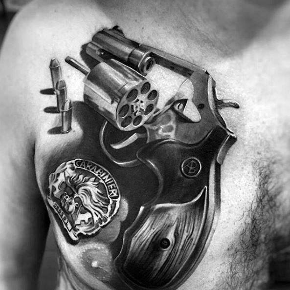 Realistic chest tattoo of a revolver, bullets, and Carabinieri badge, symbolizing authority, protection, and a life of duty or justice.