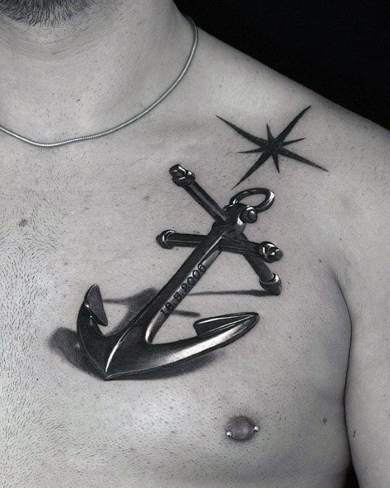 Anchor tattoo on a man's chest with a star design above it