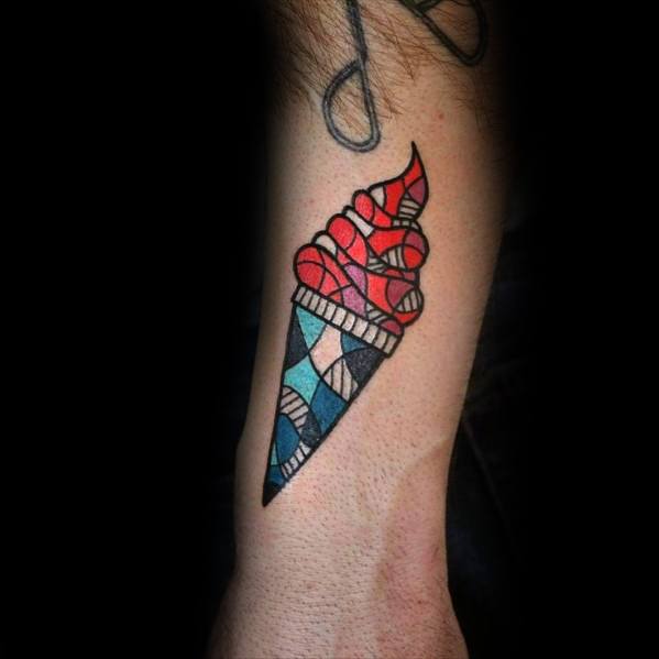 Geometric tattoo of a soft-serve ice cream cone with red and blue stained-glass-style patterns, featuring bold black outlines and a modern design.