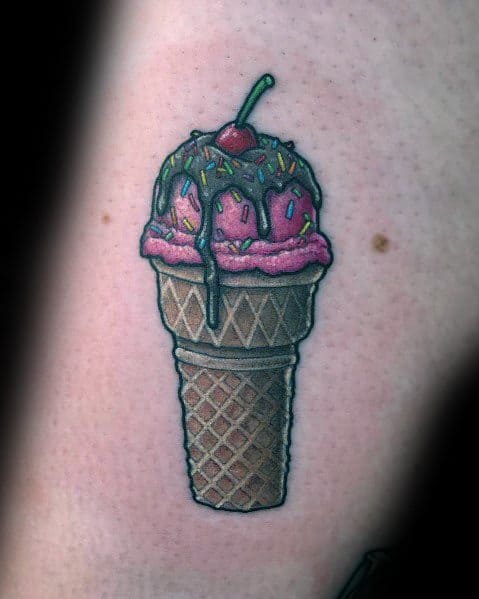 Tattoo of a pink ice cream cone with dripping chocolate syrup, colorful sprinkles, and a cherry on top, featuring bold outlines and shading.