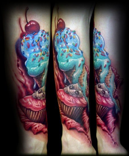 Hyper-realistic tattoo of a melting blue ice cream cone with sprinkles and a cherry, combined with eerie cupcakes featuring skull details.