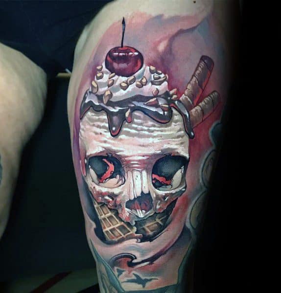Tattoo of a haunting skull-shaped ice cream cone topped with whipped cream, chocolate drizzle, nuts, a cherry, and wafer sticks, blending horror and realism.