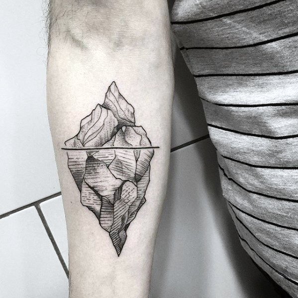 Realistic iceberg tattoo on the forearm with detailed line shading, clearly showing the massive submerged portion below the surface line.