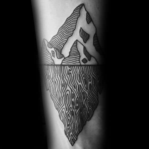 Unique iceberg tattoo with wavy line patterns above and below the waterline, mimicking topographic map textures.