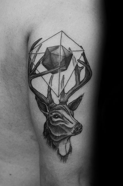 Realistic deer tattoo with antlers wrapping around a shaded icosahedron, blending nature and geometry on the upper arm.
