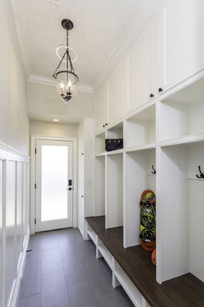 narrow white cabinet mudroom