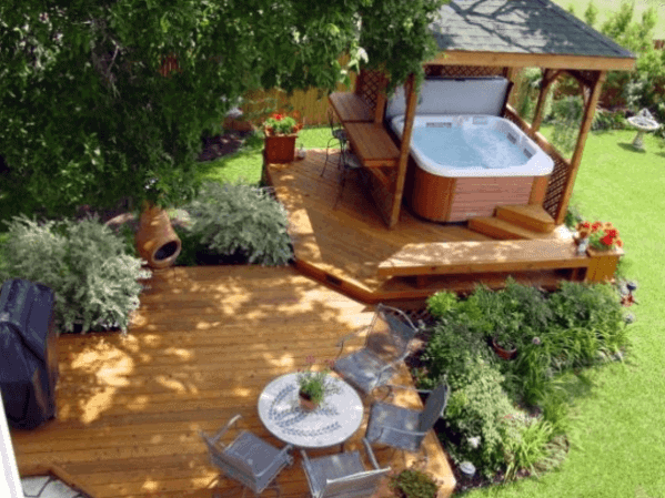 floating wood decks above ground hot tub pergola gray chairs and white table