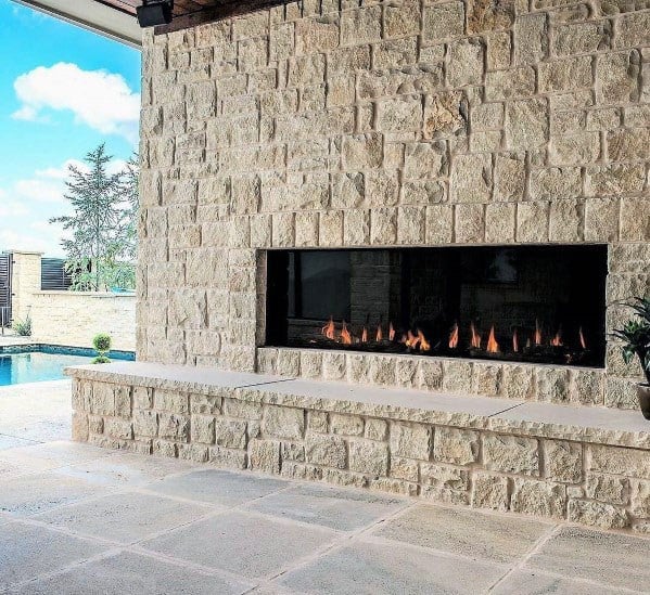 linear fireplace with stone surround