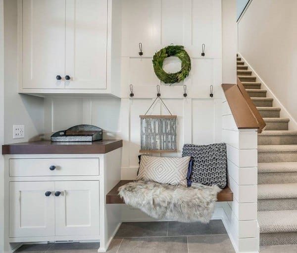 white cabinet mudroom with bench