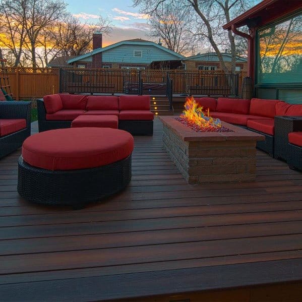 wood deck fire hot tub wicker furniture red cushions