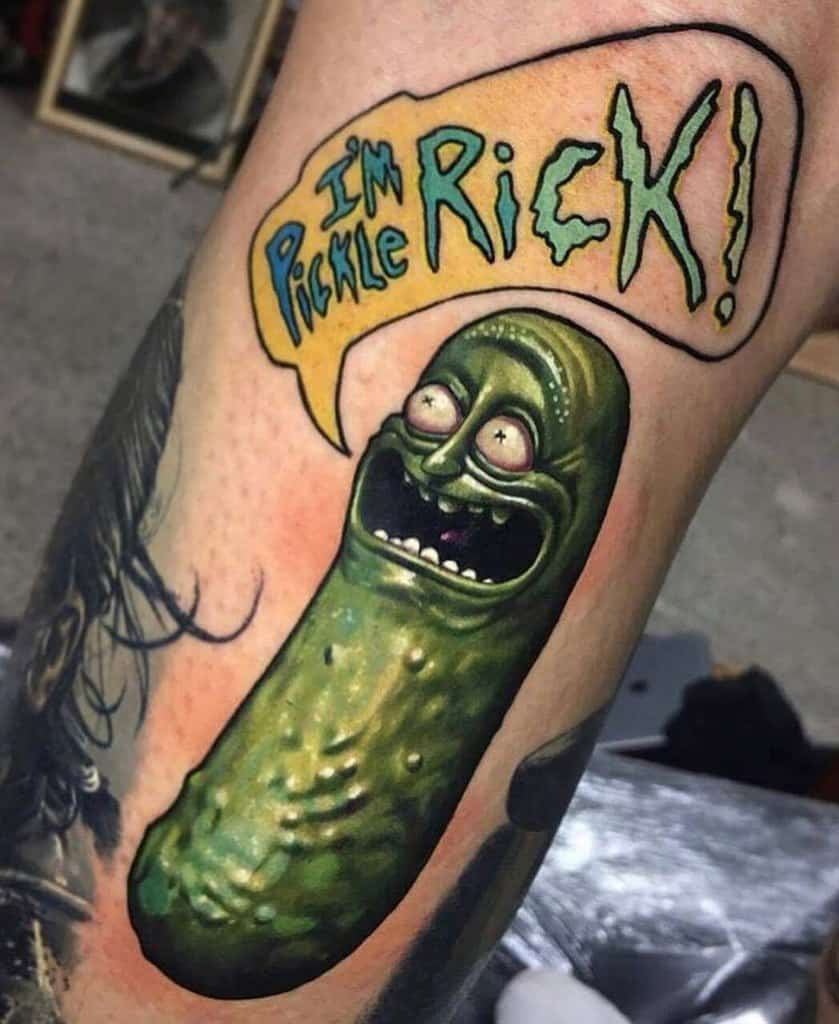 A colorful and detailed tattoo of a grinning pickle with bulging eyes, shouting 'I'm Pickle Rick!' in a bold comic-style speech bubble.