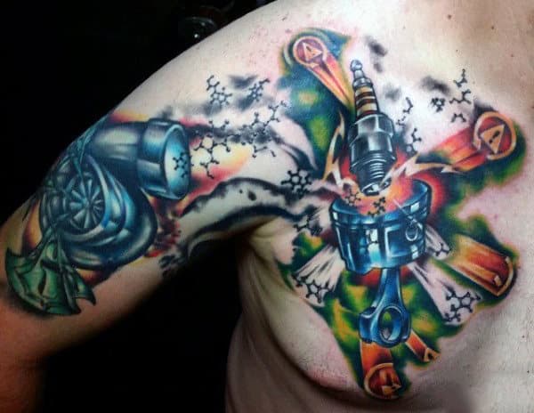 Colorful tattoo on upper arm featuring a piston, spark plug, and turbocharger with a vibrant mechanical-themed design