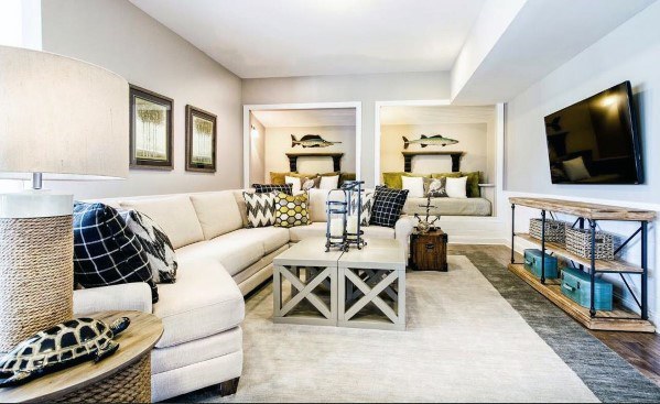Cozy living room with sectional sofa, wall-mounted TV, and built-in nooks.