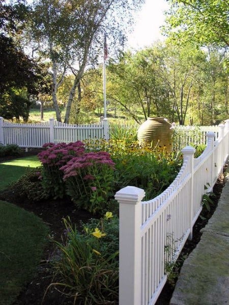 white vinyl fence front yard garden 