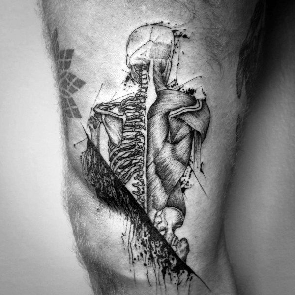 Detailed anatomical tattoo of a human back with exposed spine, shoulder muscles, and skull, combining fine lines and artistic splatter effects.