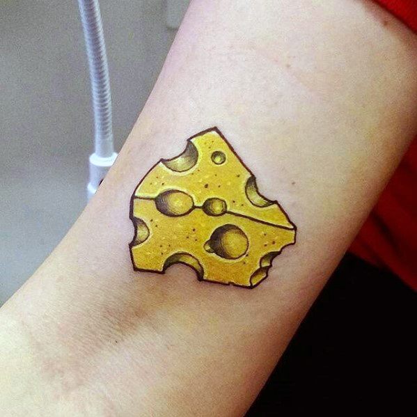Colorful tattoo of a wedge of Swiss cheese with bold black outlines and rich yellow shading, featuring realistic texture and subtle highlights.