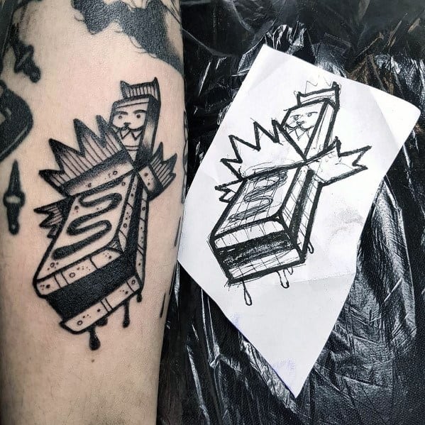 Dripping chocolate swirl tattoo entwined with geometric shapes, blending edgy and modern aesthetics.