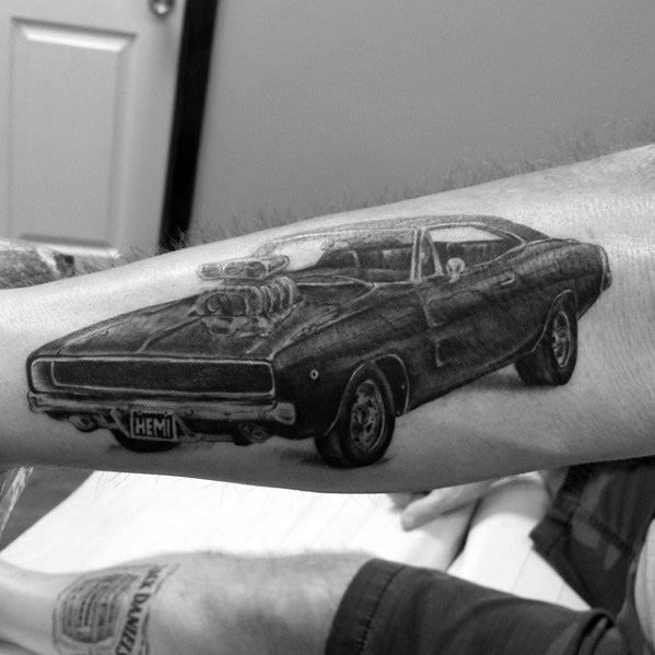 Realistic black and grey Dodge Charger tattoo with a supercharged HEMI engine, showcasing power and classic muscle car style.