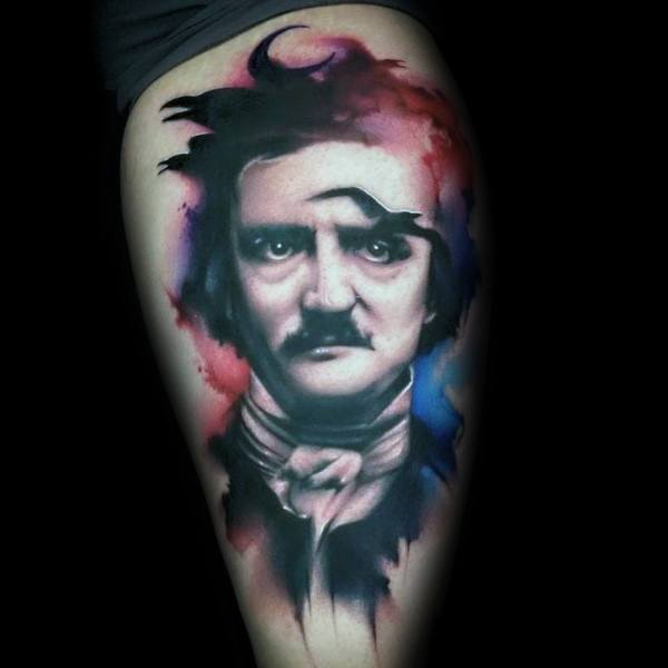 Watercolor-style Edgar Allan Poe tattoo with vivid splashes of red, pink, and blue surrounding a realistic portrait.
