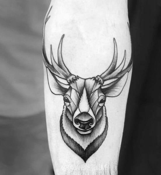 Minimalist black and grey elk tattoo on the forearm, featuring fine linework, bold shading, and a symmetrical design for a sleek modern look.
