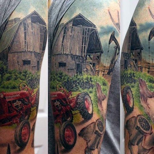 Colorful sleeve tattoo of a rustic barn, red tractor, pigs, and lush greenery under a cloudy sky in a detailed farm scene.