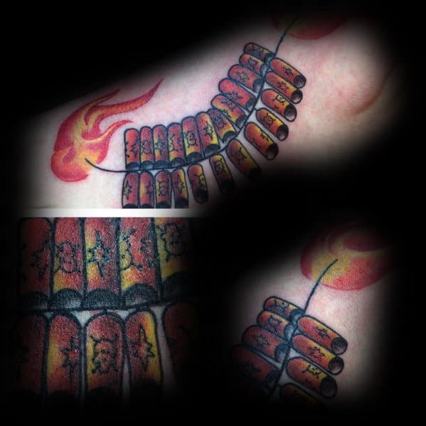 Tattoo of a string of firecrackers with a lit fuse, featuring bold red and yellow flames, detailed shading, and a dynamic traditional design.