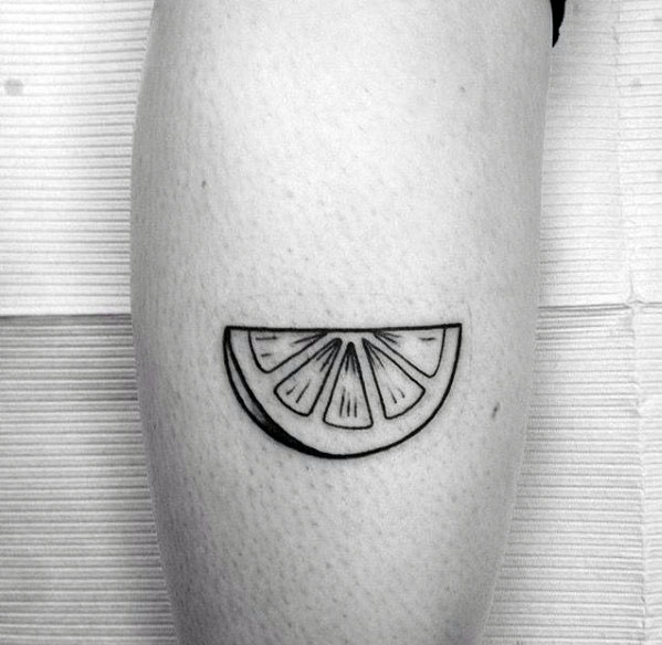Simple black line lime wedge tattoo with clean detailing, creating a minimalist and stylish citrus-inspired design.