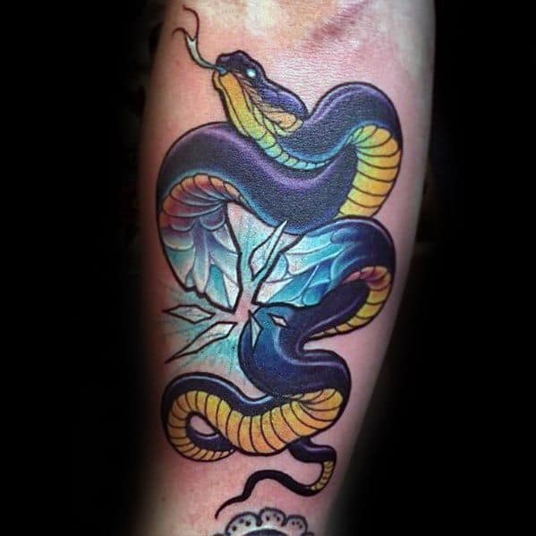 Neo-traditional tattoo of a black and gold snake coiled around a cracked ice-like crystal, featuring bold shading and vibrant blue highlights.
