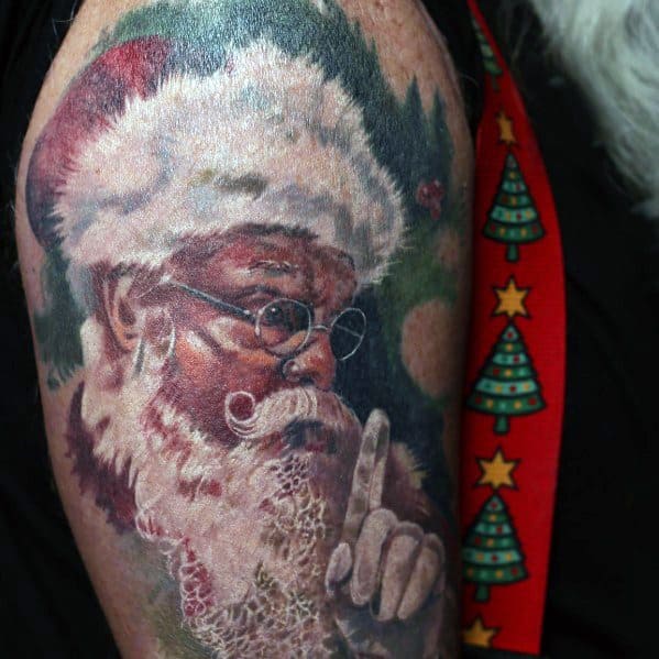 Realistic Santa Claus tattoo with fine details, featuring him wearing glasses and making a shushing gesture, capturing a classic festive mood.