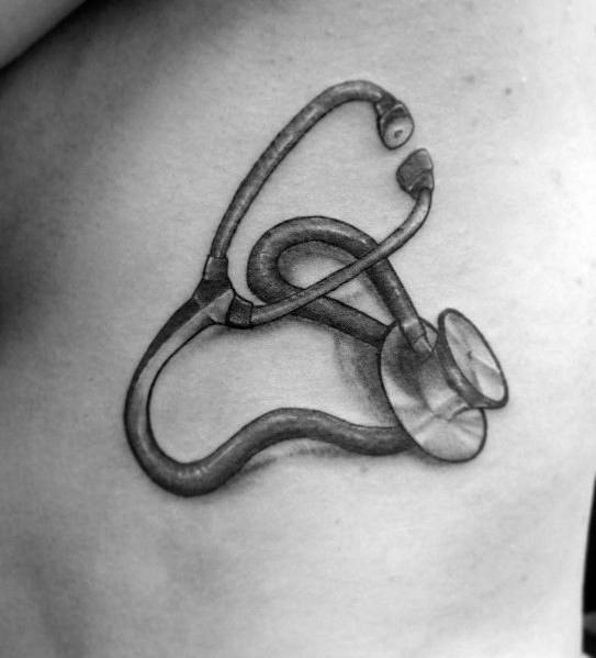 Realistic stethoscope tattoo with detailed shading, symbolizing dedication to the medical field and a passion for healthcare.