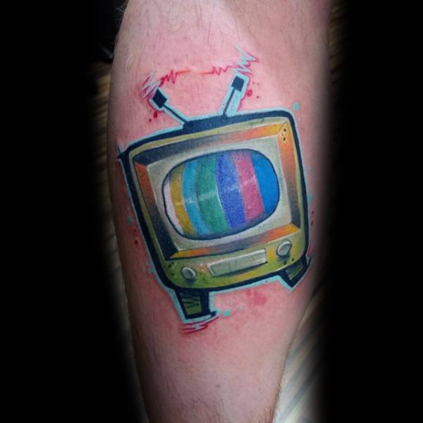Colorful tattoo of a retro TV with static rainbow stripes on the screen, antennas emitting electric signals, and a slightly distorted, surreal design.