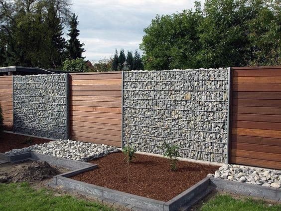 wood and rock modern fence design