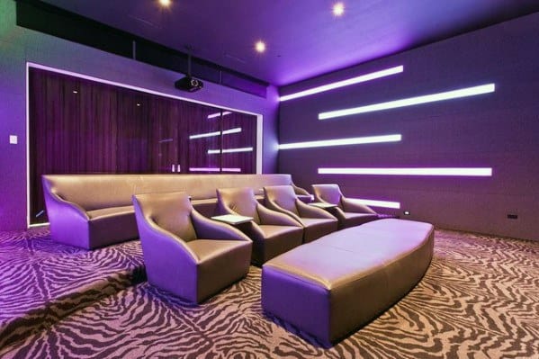 large modern home theater with purple lighting 