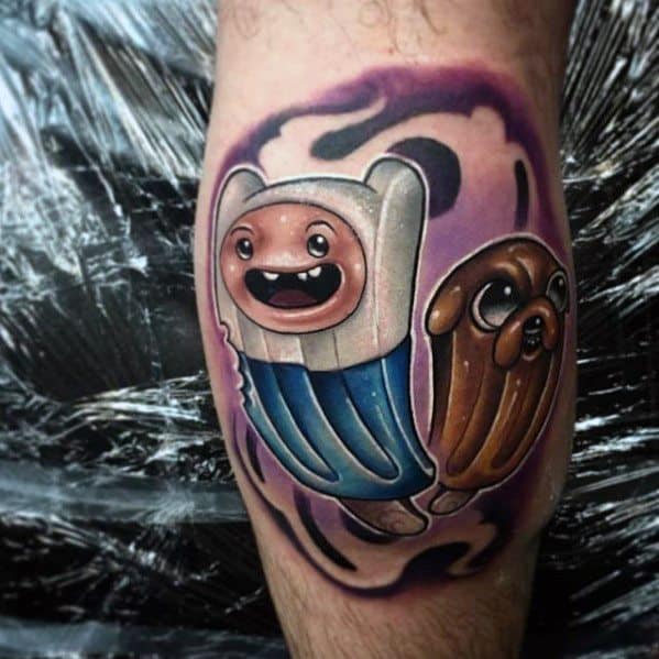 Adventure Time tattoo of Finn and Jake with shiny, 3D-style shading and a swirling purple-black background, placed on the calf.