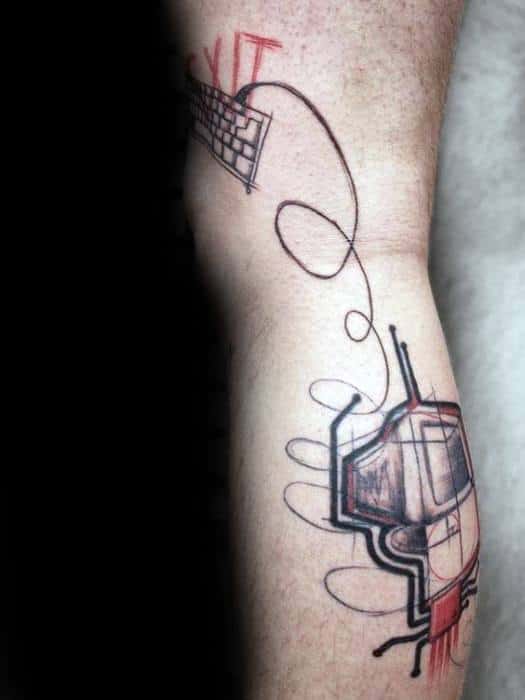 Abstract tattoo of a retro computer and floating keyboard with sketch-style lines and red accents, creating a dynamic tech-art fusion.