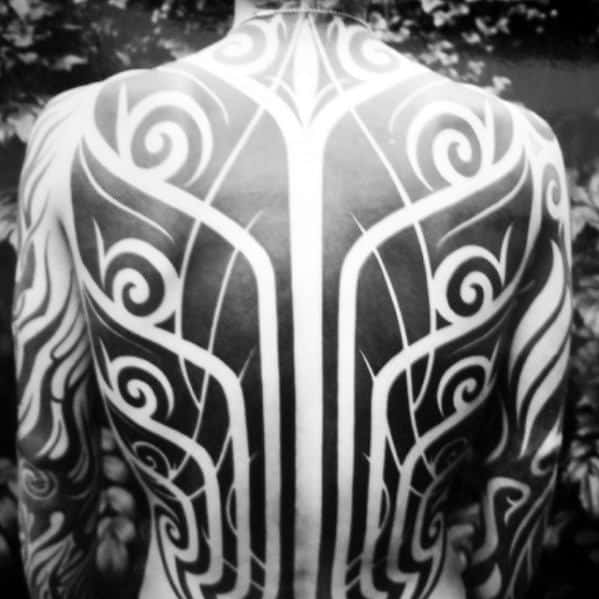 Incredible Awesome Tribal Negative Space Tattoos For Men
