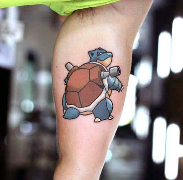 Clean and simple Blastoise tattoo on the thigh, showcasing its full back view with water cannons and a bold outline style.