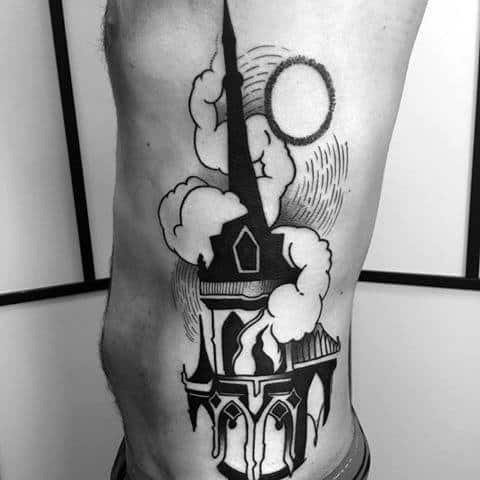 Blackwork tattoo of a burning church on the ribs with bold outlines and smoke clouds. A glowing sun or moon shines behind the steeple.
