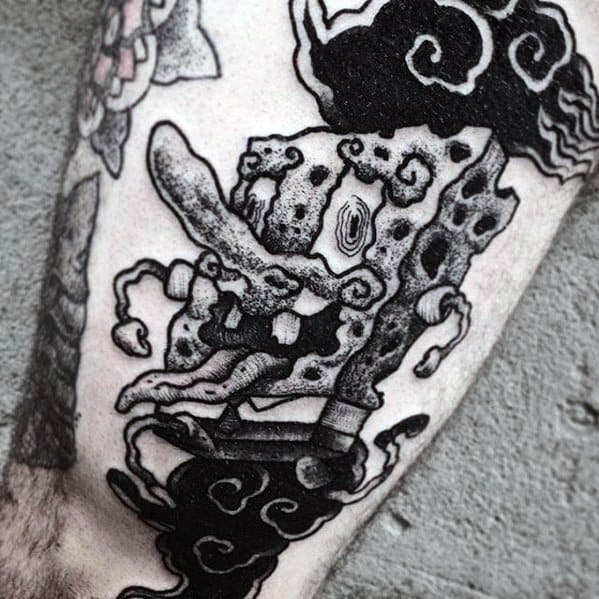 Black and grey tattoo of SpongeBob SquarePants with a twisted, smoky, and almost demonic appearance, surrounded by swirling dark clouds.