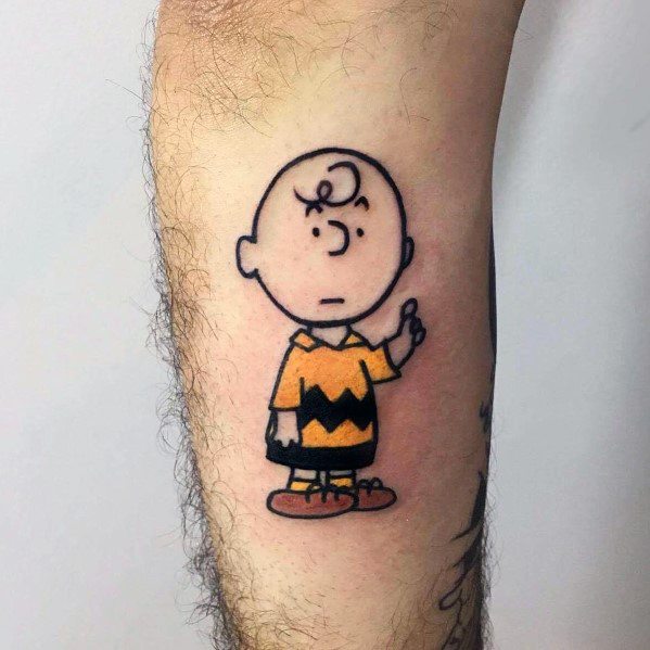 Simple and bold Charlie Brown tattoo with his classic confused expression and raised hand, capturing the essence of Peanuts humor.