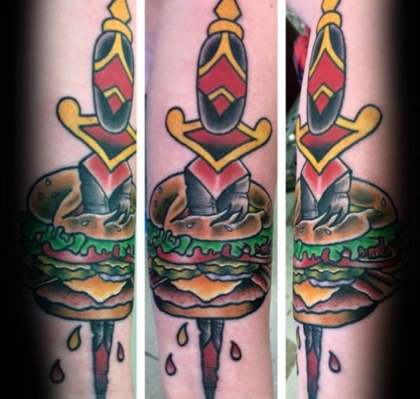 Sword piercing a cheeseburger tattoo, with colorful shading and dripping details